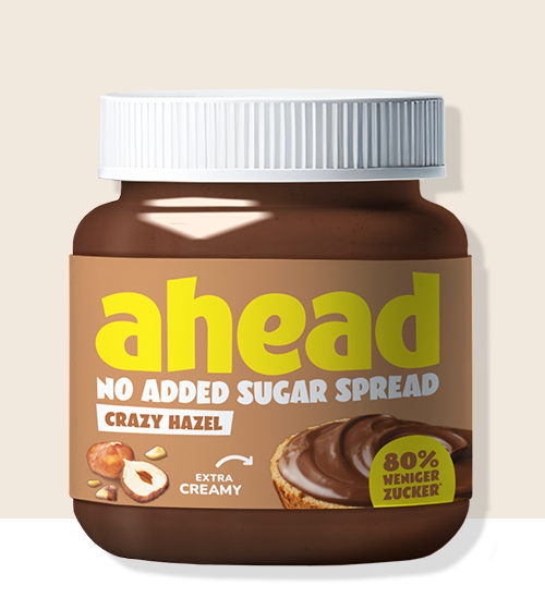 Jar of hazelnut spread with no added sugar, labeled 'ahead,' featuring creamy texture.